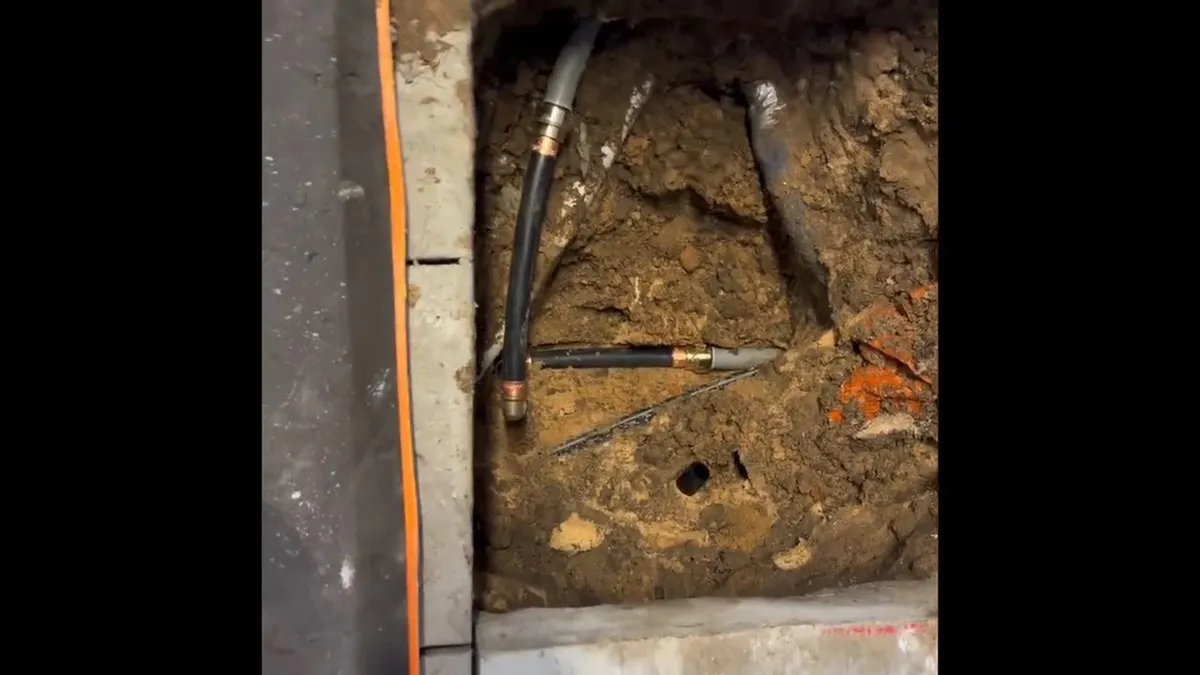 opened slab trench reveals supply lines and fittings beneath the floor for burst pipe repair in maricopa, az in Maricopa