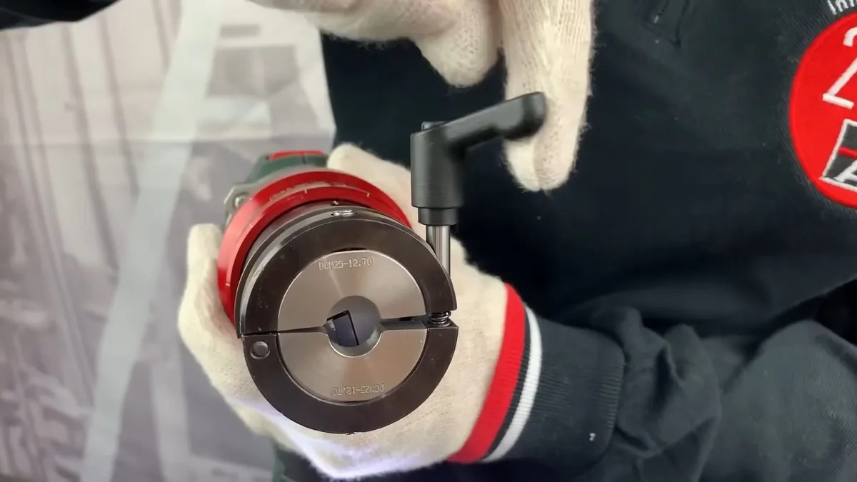 gloved installer holds a compact circular pipe-preparation tool during a plumbing service call in Maricopa, AZ
