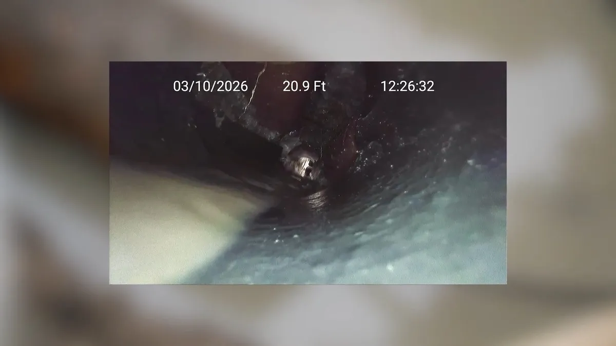 sewer camera monitor displays the inside of a dark drain line during a plumbing service call in Maricopa, AZ