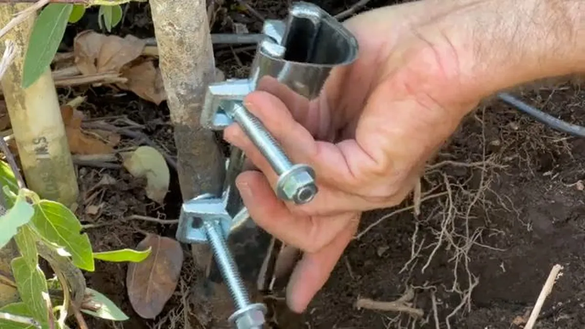 metal pipe repair clamp and bolts are shown before installation outdoors for hose bib & outdoor faucet repair in maricopa, az in Maricopa