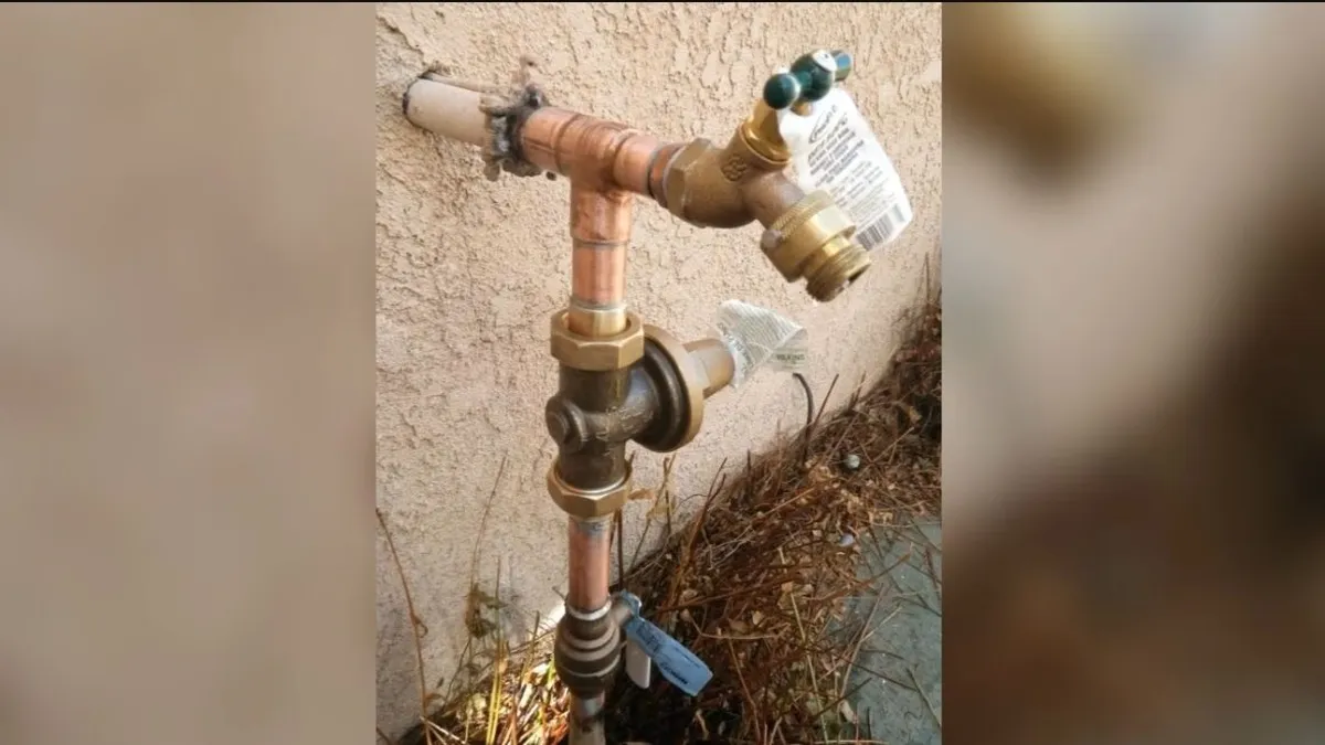 outdoor hose bib and shutoff assembly are mounted on a stucco wall for hose bib & outdoor faucet repair in maricopa, az in Maricopa