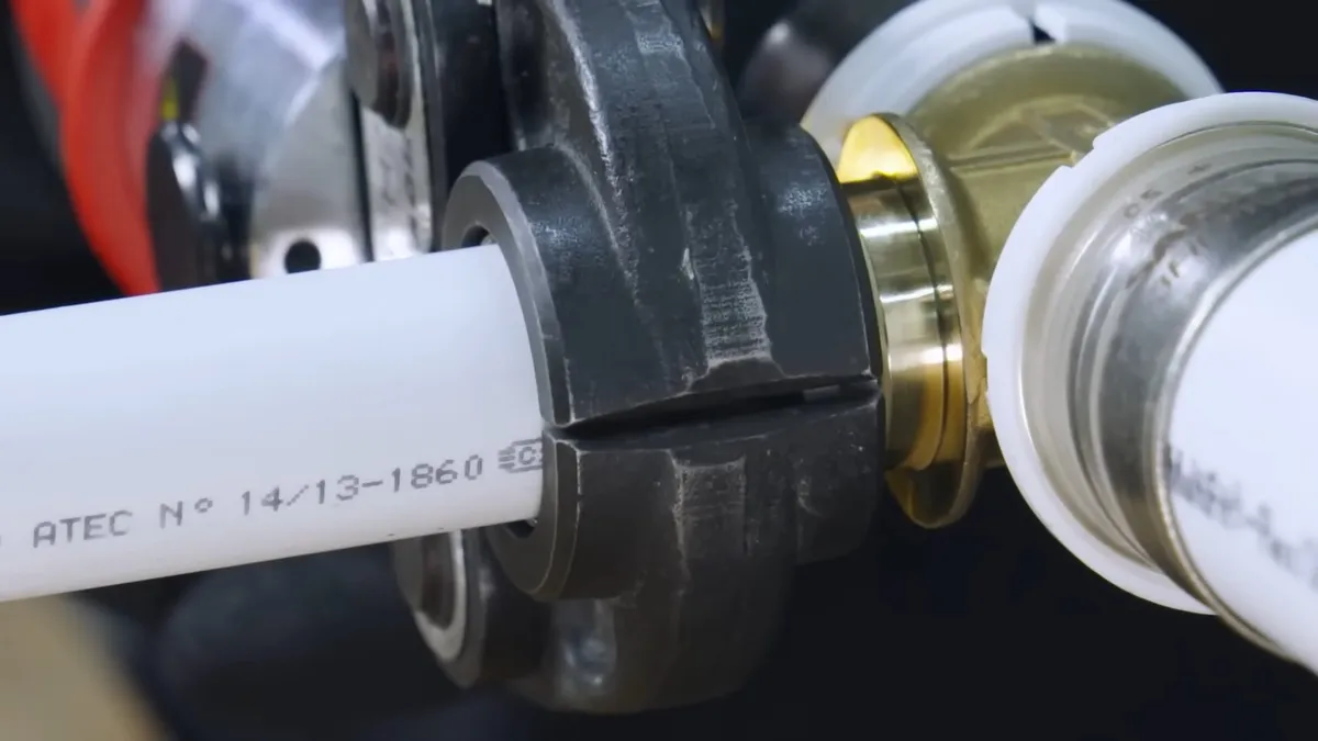 plastic pipe fitting is seated in a powered pressing tool before the connection is made for all plumbing services in maricopa, az in Maricopa