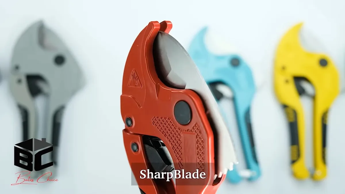 red ratcheting pipe cutter is displayed with other cutting tools behind it for all plumbing services in maricopa, az in Maricopa