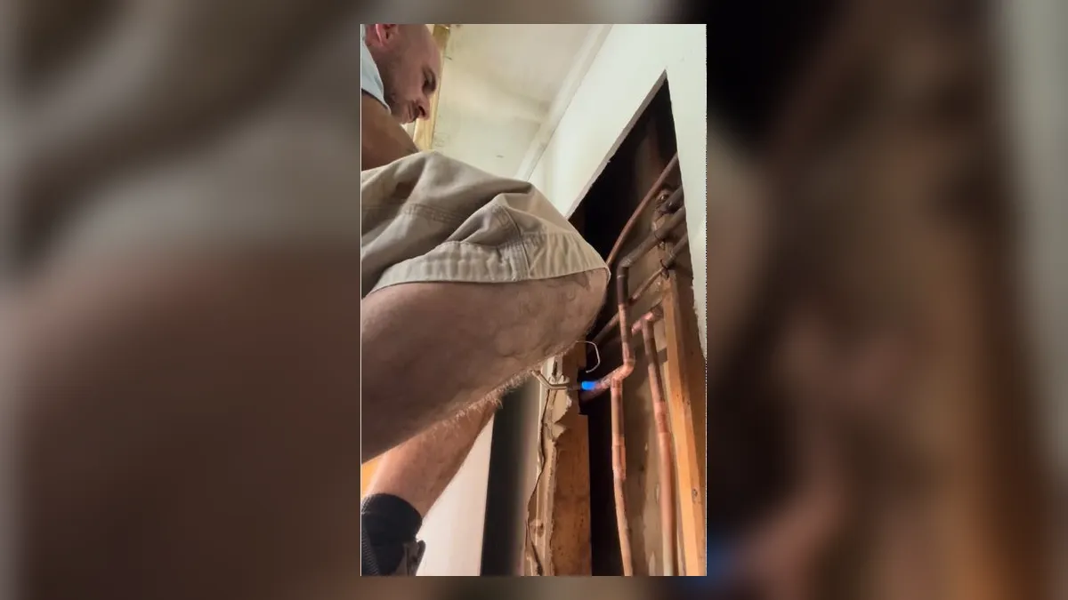 opened wall cavity reveals a vertical pipe being checked for leakage for leak detection in maricopa, az in Maricopa