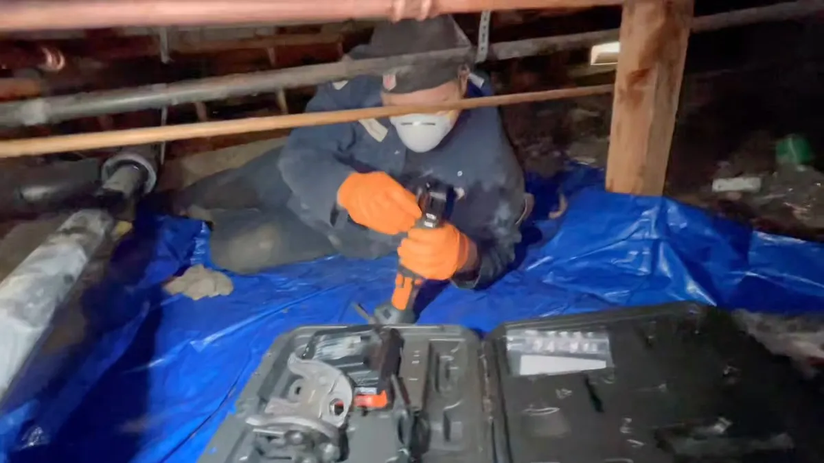 powered repair tool is positioned on a pipe beneath a home for leak detection in maricopa, az in Maricopa