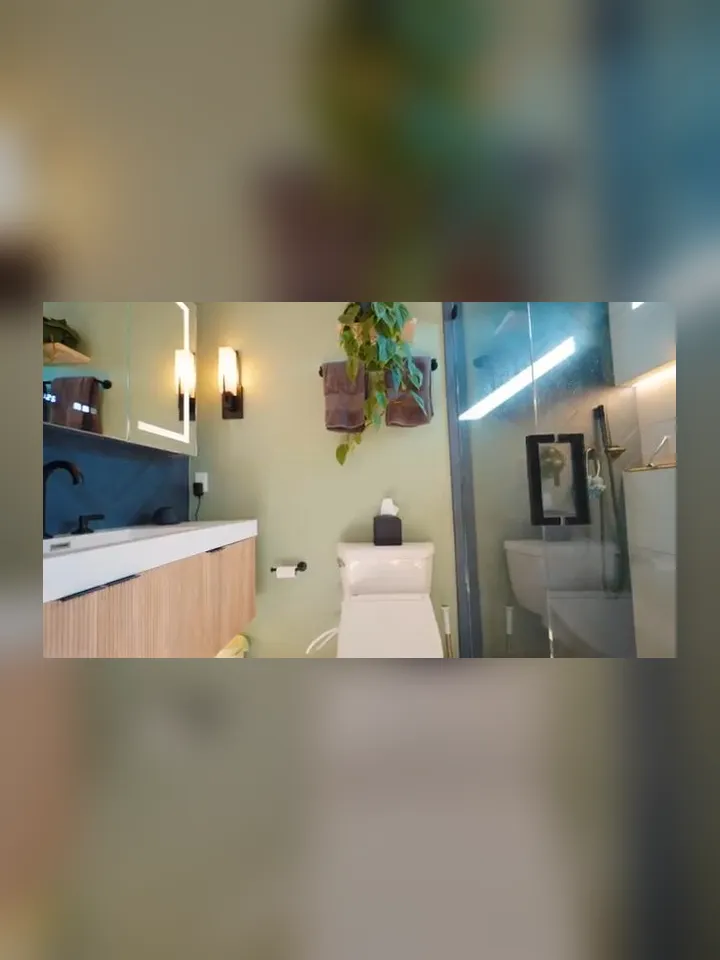 renovated bathroom combines a modern vanity, toilet, mirror, and glass shower for Maricopa AZ Plumbing Guys