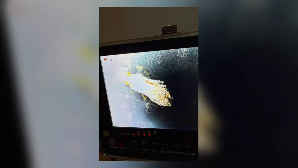 camera monitor shows debris and damage inside a drain or pool line for pool leak detection & repair in maricopa, az in Maricopa