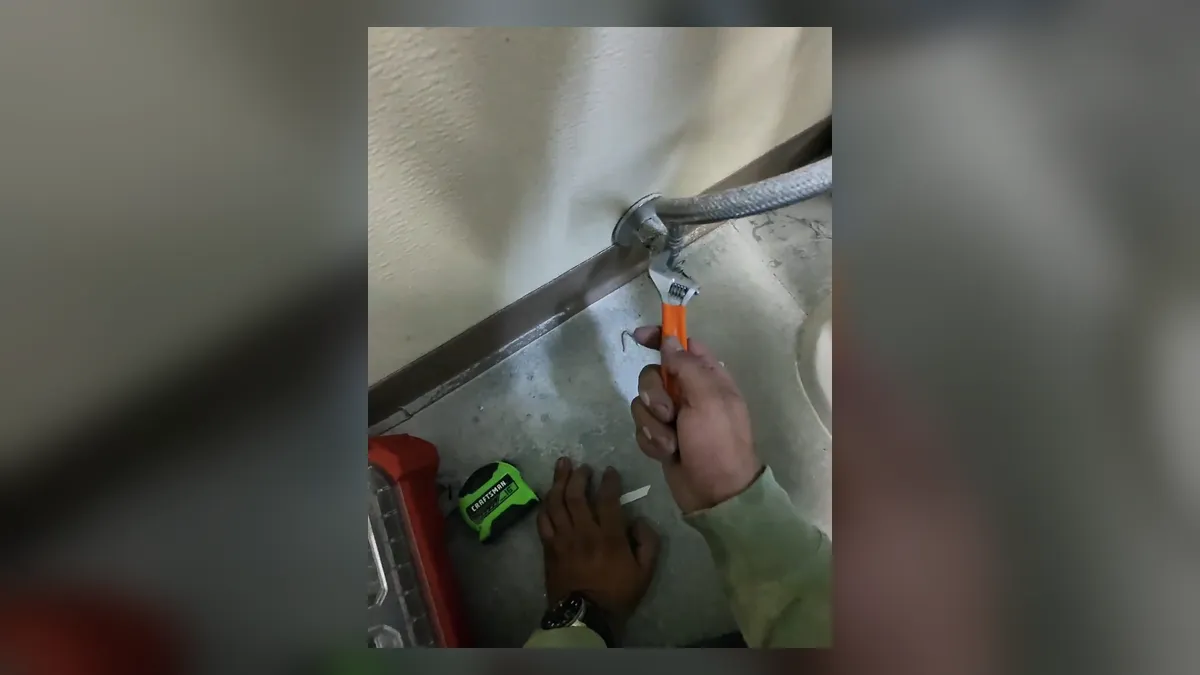 torch heats a copper joint during commercial bathroom plumbing work during a plumbing service call in Maricopa, AZ