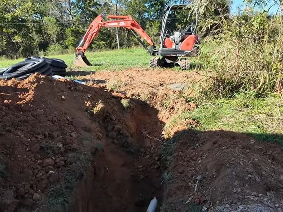 deep yard trench is opened for replacement of a buried drain line for sewer line replacement in maricopa, az in Maricopa
