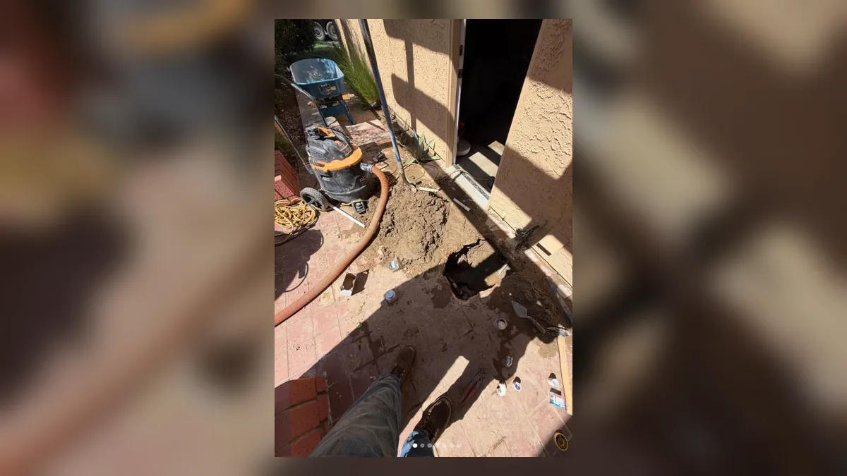 exterior slab edge is opened to access piping beside a wall illustrating Slab Leak Detection and Repair Cost in Maricopa, AZ: What to Expect in 2025