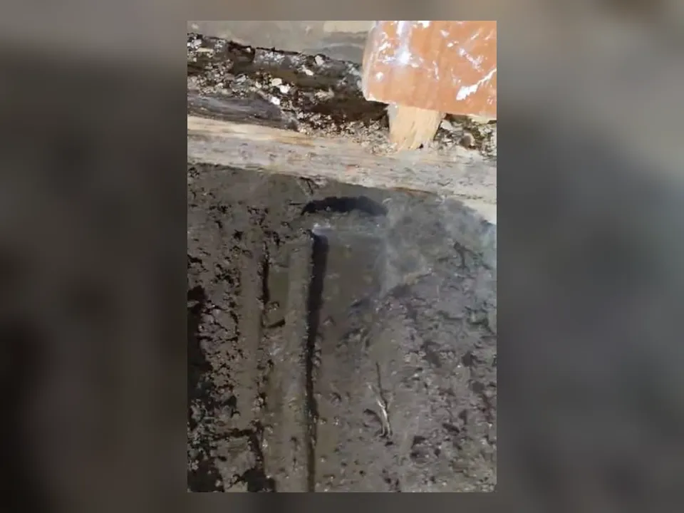 long narrow channel has been cut through concrete to reach a buried line for slab leak detection & repair in maricopa, az in Maricopa