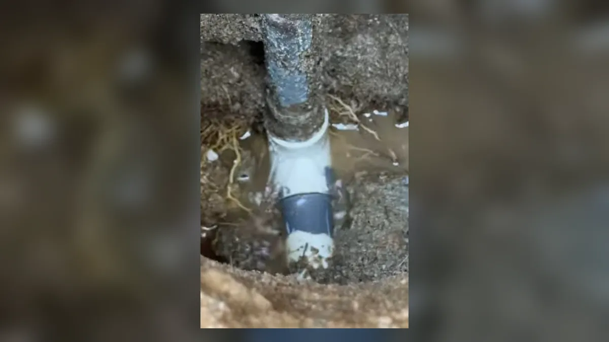 white repair fitting joins a pipe inside a small slab excavation for slab leak detection & repair in maricopa, az in Maricopa
