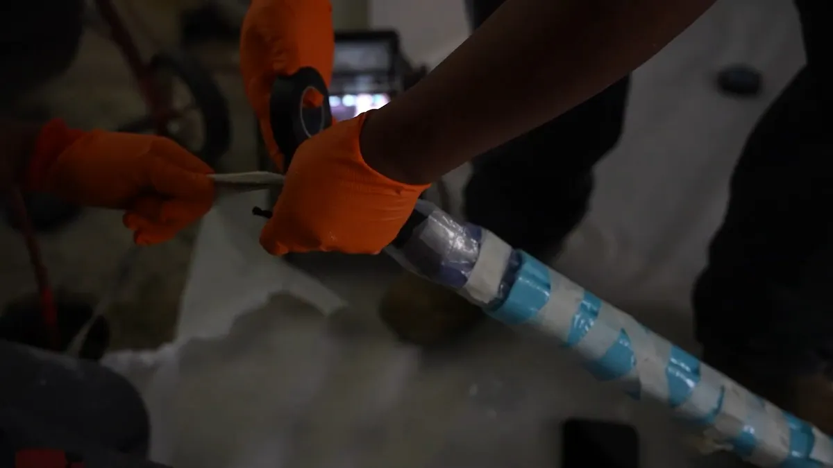 blue epoxy liner is fitted inside an existing underground pipe illustrating Slab Leak Repair in Maricopa: Spot Repair, Pipe Rerouting, or Epoxy Lining?