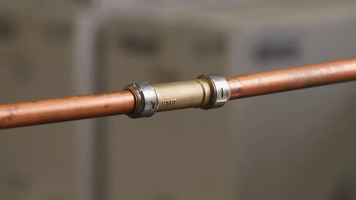 repair coupling bridges the damaged section of a copper line during a plumbing service call in Maricopa, AZ