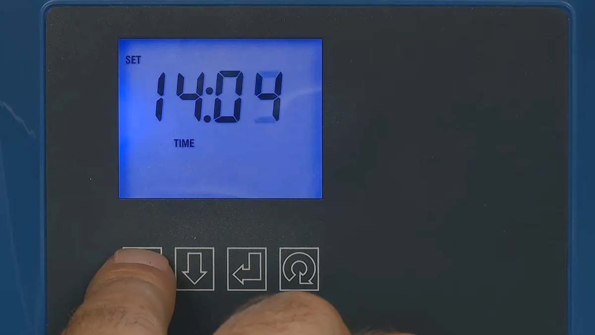 digital controller displays the programmed regeneration time during a plumbing service call in Maricopa, AZ