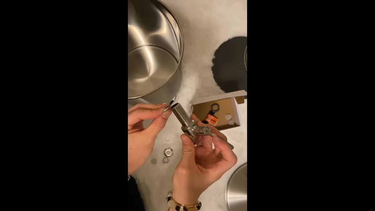 installer connects a stainless countertop gravity water filter at a sink for water filtration installation in maricopa, az in Maricopa