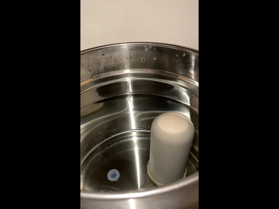 stainless filter chamber and white cartridge are shown during assembly for water filtration installation in maricopa, az in Maricopa