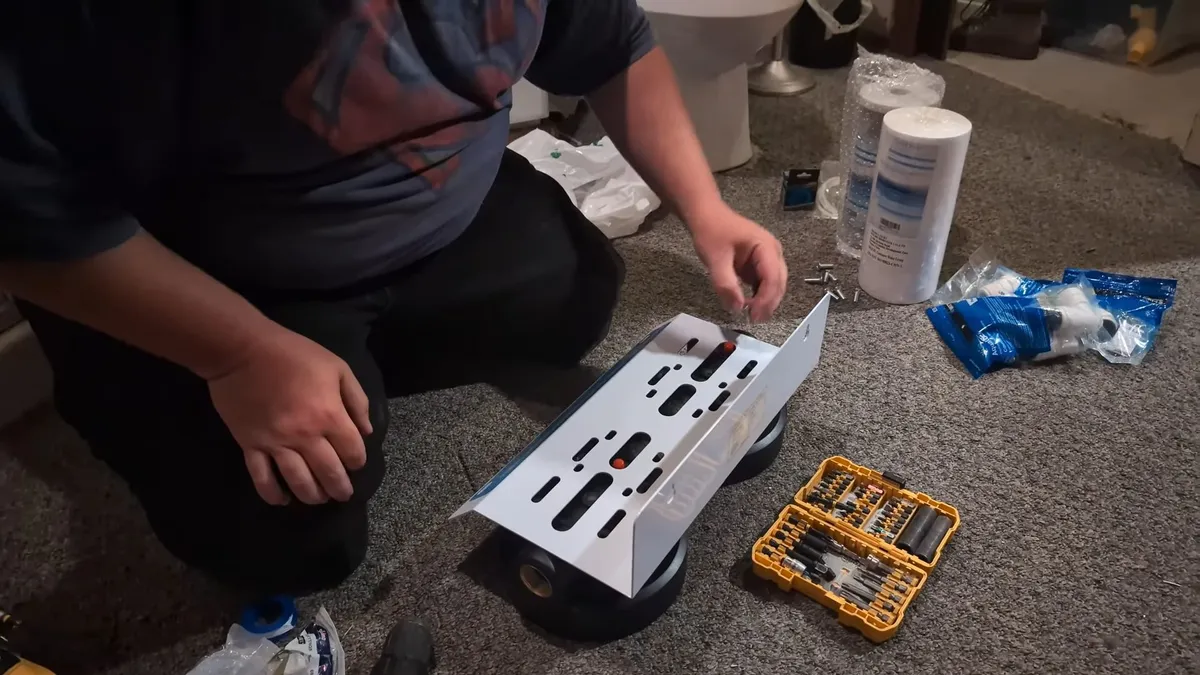 whole-house filtration kit, tubing, and fittings are unpacked for installation illustrating Softener Plus RO: Why Maricopa Homeowners Need Both Systems and How They Work Together