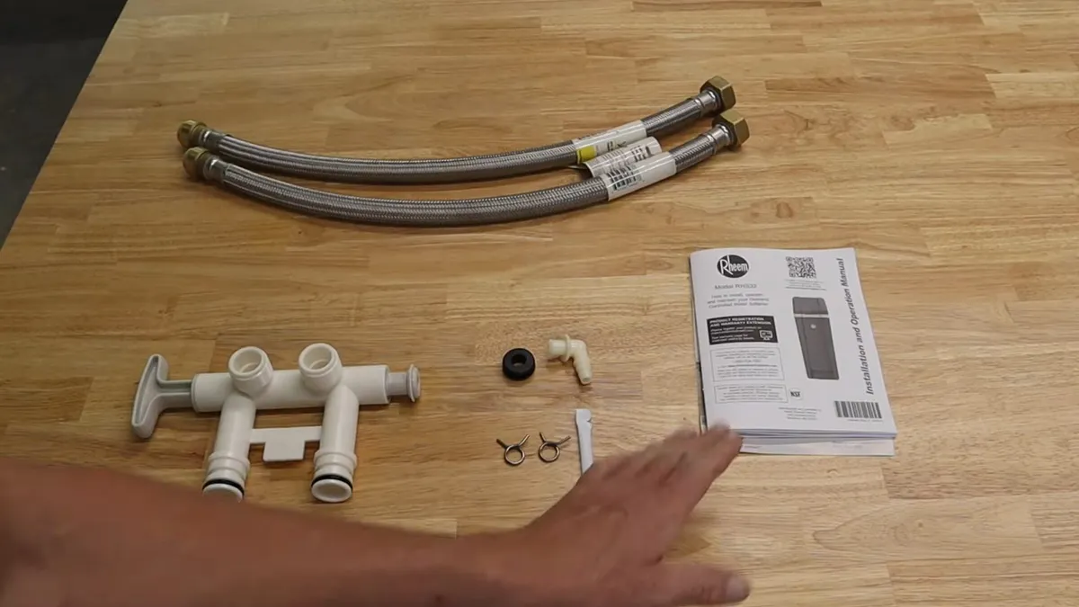 Water-softener hoses, valves, fittings, and instructions are laid out before installation for water softener installation & repair in maricopa, az in Maricopa
