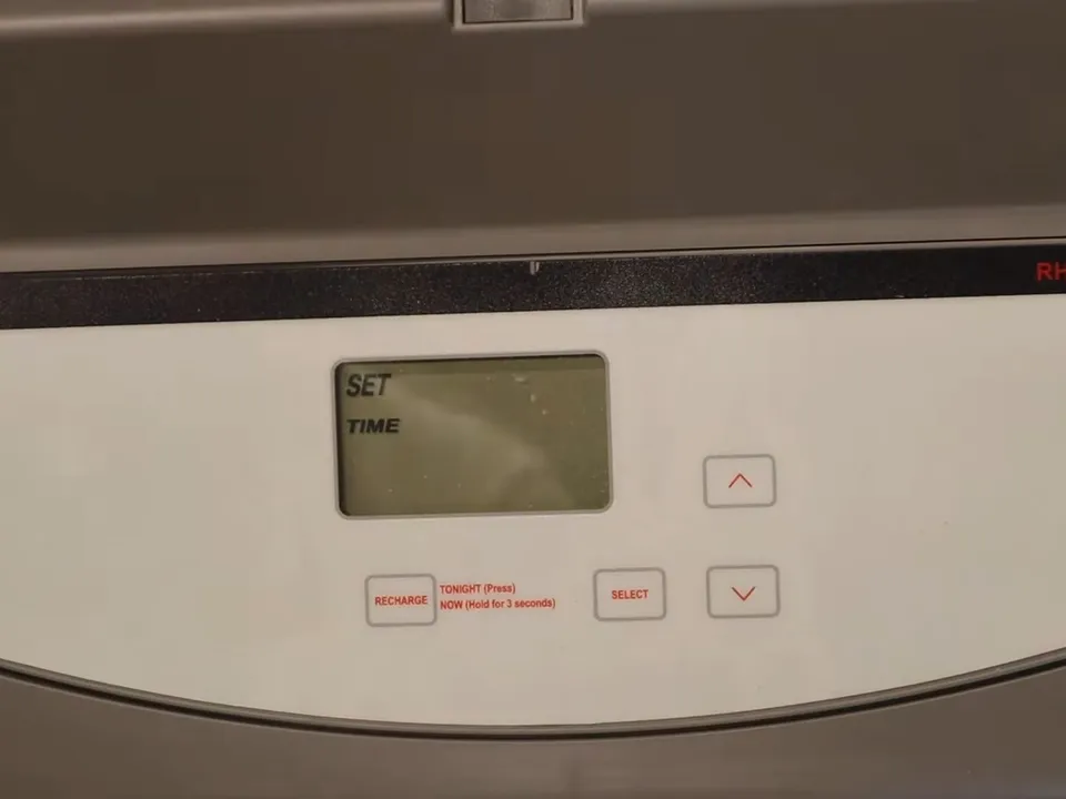 wall-mounted electronic controller is prepared for a water-softener setup for water softener installation & repair in maricopa, az in Maricopa