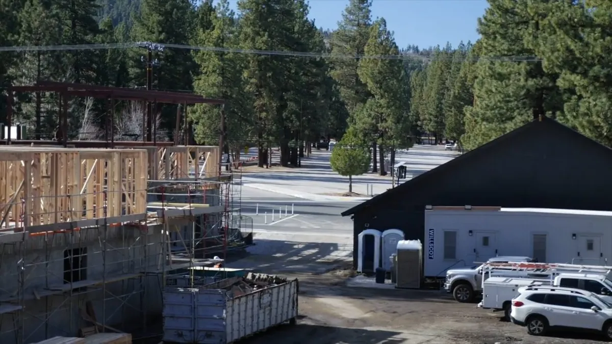 large hotel-style construction site shows active framing, plumbing, and service vehicles illustrating Why Maricopa Plumbing Is Different from the Rest of Arizona — and What Every New Homeowner Needs to Know